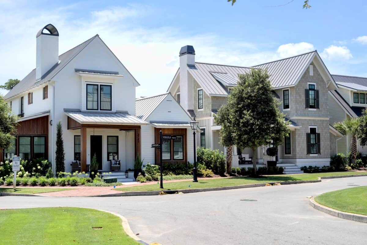 Contemporary houses in Landfall with well-maintained lawns and trees.