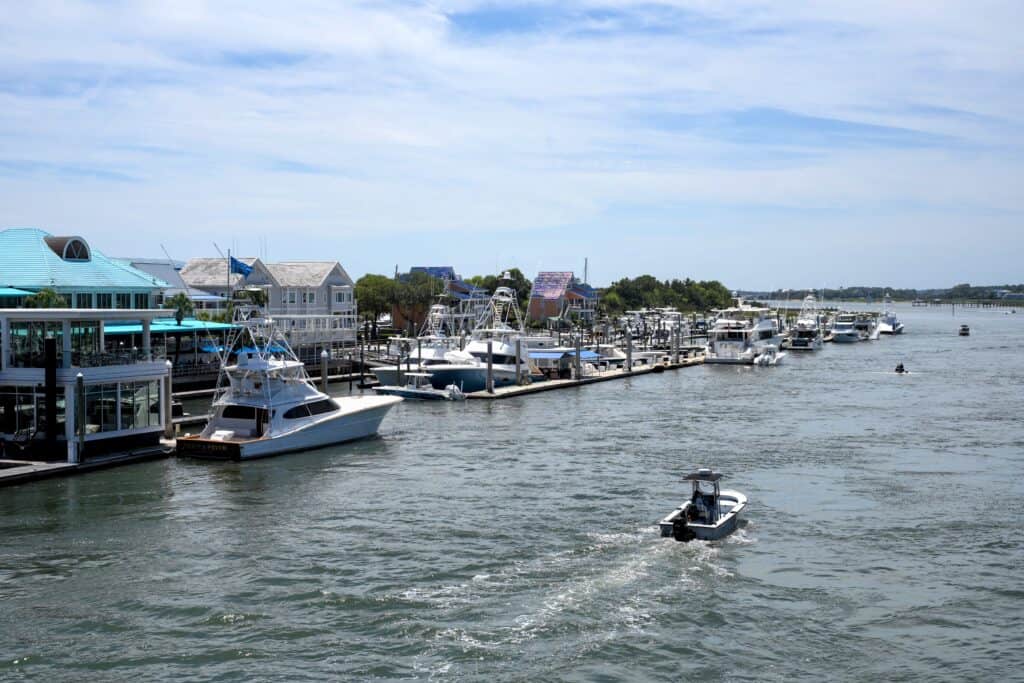 Marina with boats and waterfront homes in Making ILM Home.