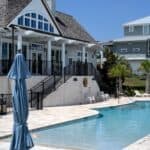 Elegant house with swimming pool, outdoor seating, and modern design features.