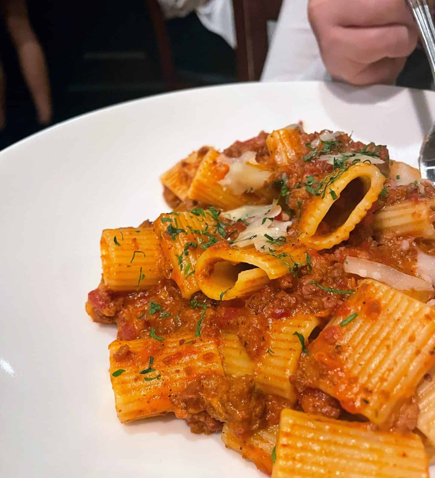 Rigatoni in a tomato meat sauce, finished with shaved cheese and chopped parsley, at Brasserie du Soleil.