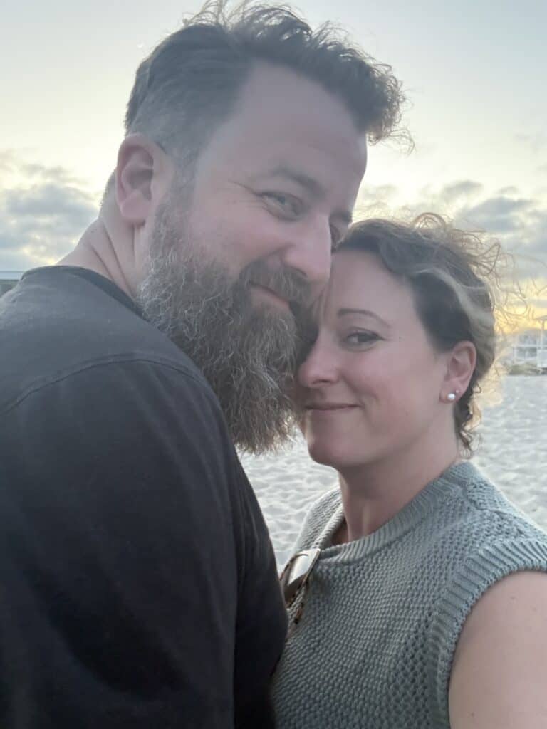 Tabetha and her husband at sunset by the water near Wilmington, NC