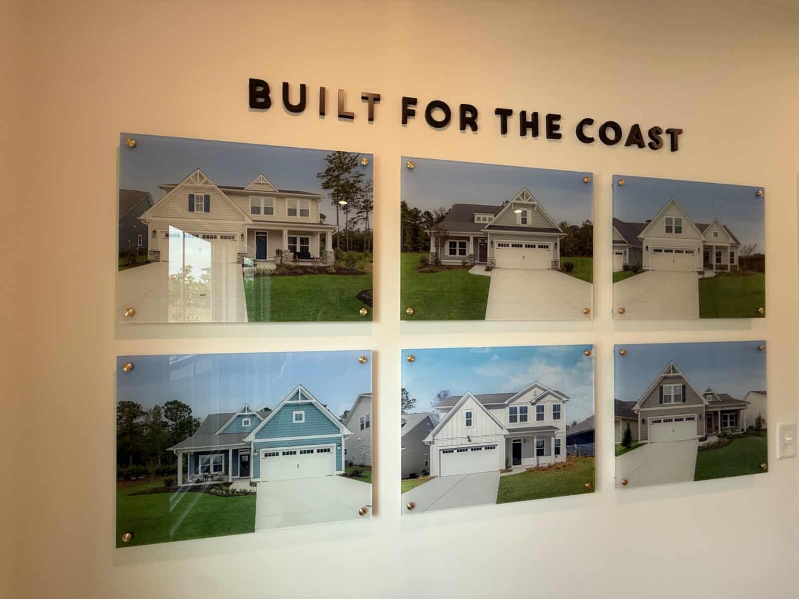 A 'Built for the Coast' builder display of completed craftsman-style homes.