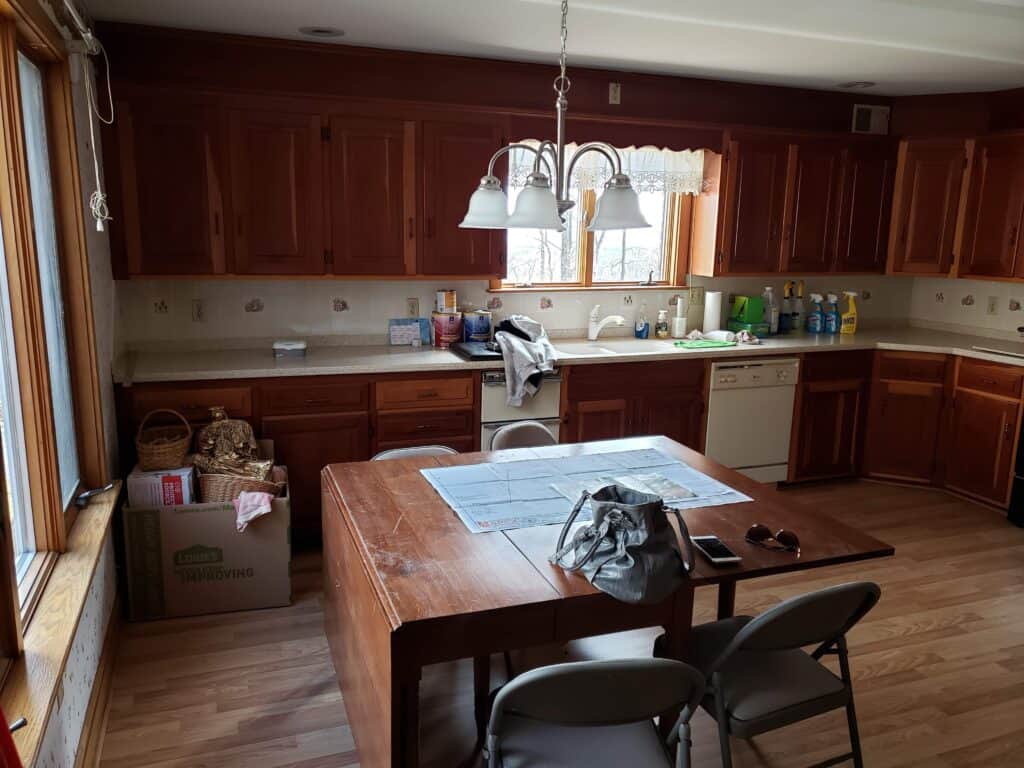 Kitchen before renovation with dark cherry cabinets