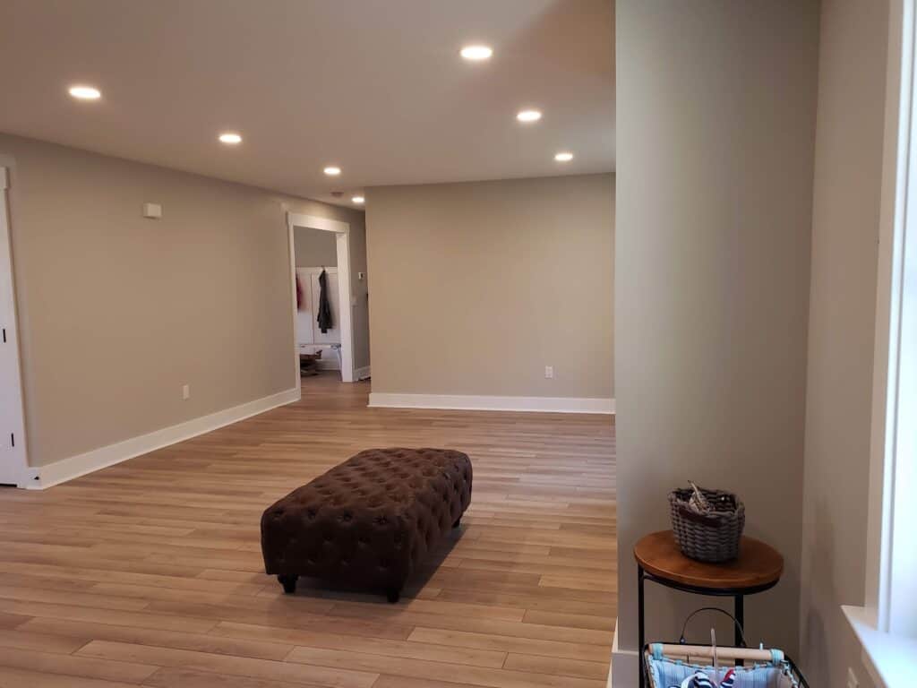 Renovated open living space with new flooring