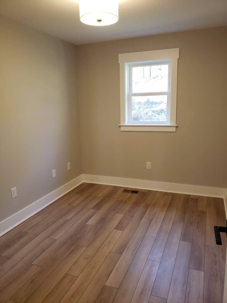 Bright renovated room with new floors and trim