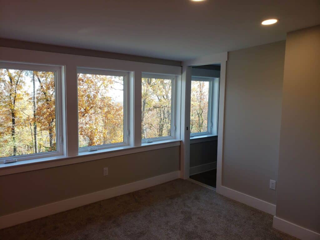 Sunroom with a wall of windows after renovation