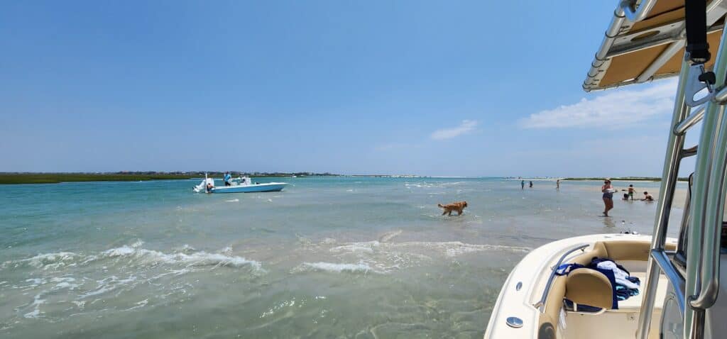 Boats anchored off a sandbar on a summer day near Wilmington NC, one of the day-to-day changes after moving from Boston