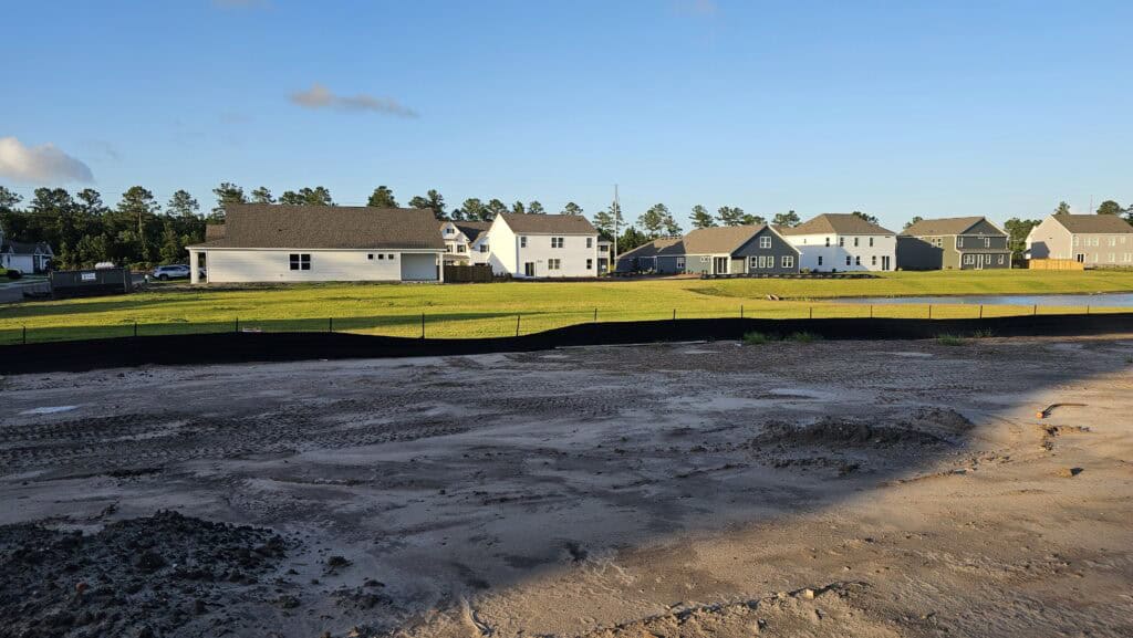 Street of new single-level homes in a growing Wilmington-area neighborhood, the kind of setting many 55+ communities near Wilmington NC are built in