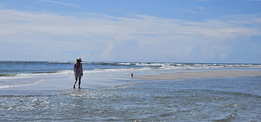 Walking the beach at low tide near Wilmington NC, a short drive from where people moving from Raleigh tend to look