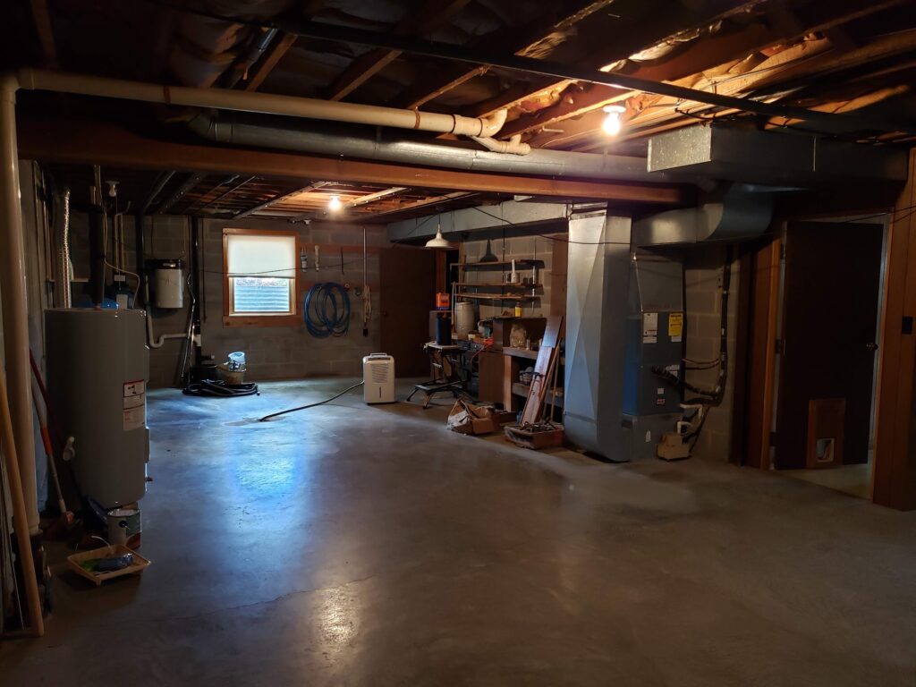 Unfinished side of the basement with mechanicals