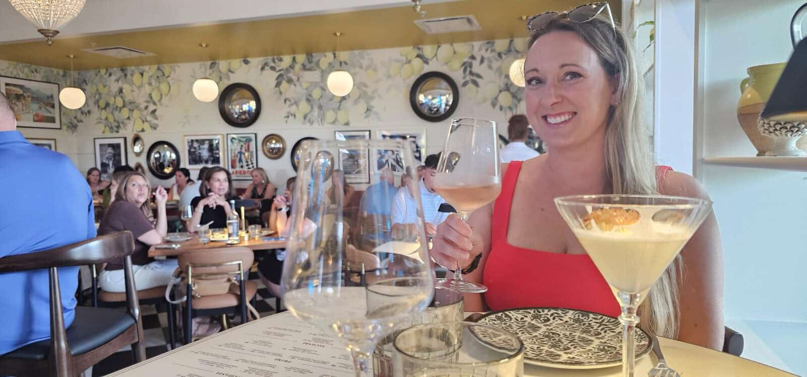 Enjoying rosé and a dessert martini in the lemon-wallpapered dining room at Fortuna Cucina Italiana in Wilmington NC