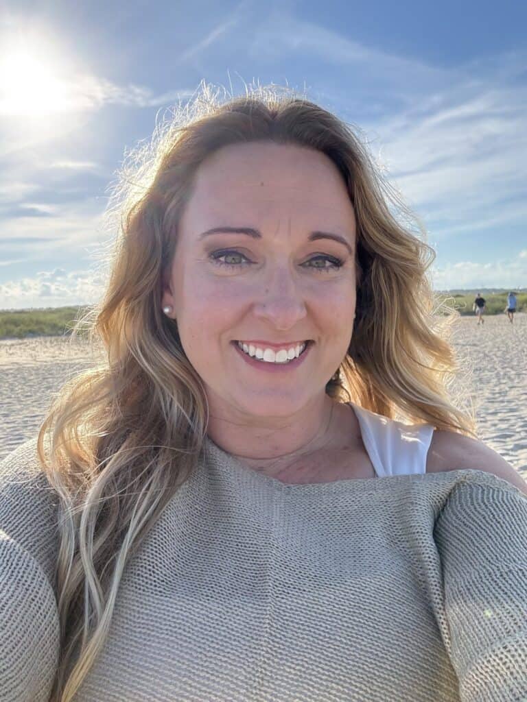 Tabi Klein, REALTOR® with Coldwell Banker Sea Coast Advantage, smiling at Wrightsville Beach